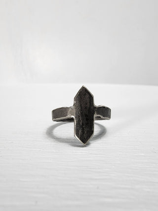 Black stainless steel ring with an elongated face with ends coming to a point