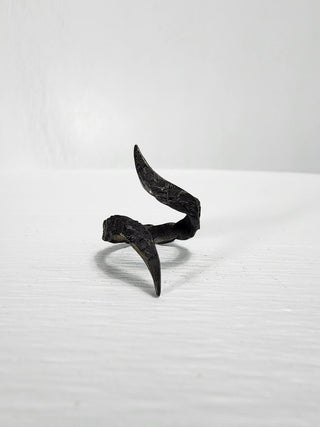 Black gothic textured stainless steel ring with curled and pointed edges