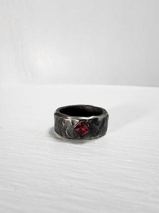 Black hammered stainless steel ring with ruby gemstone