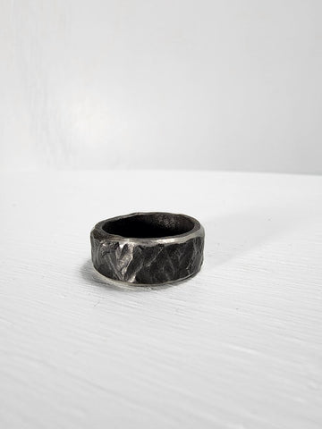 Black hammered stainless steel ring with ruby gemstone