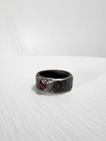 Black hammered stainless steel ring with ruby gemstone